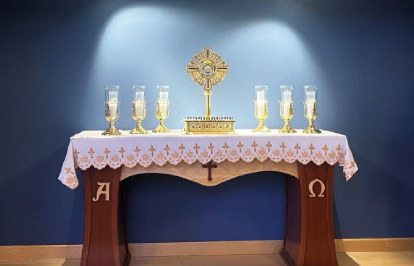 Monstrance on the altar with candles